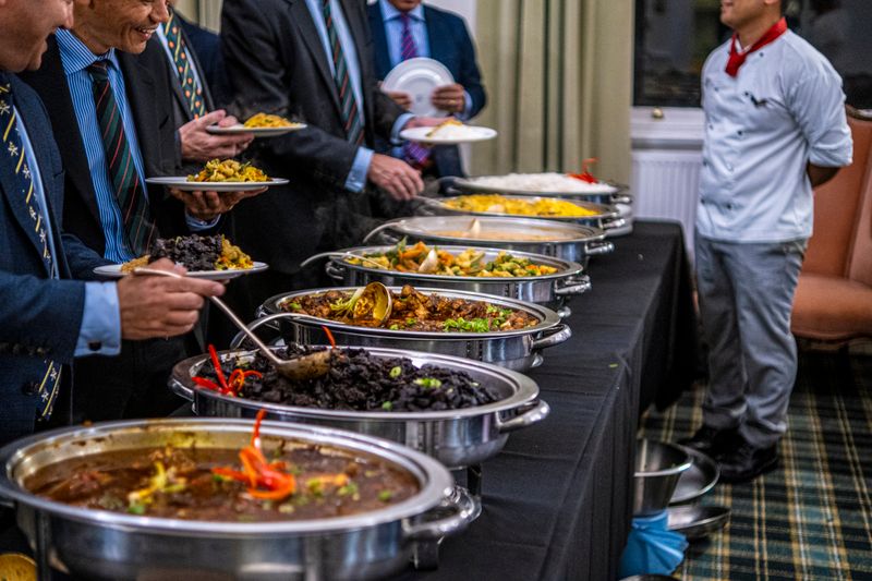 Corporate lunch catering event featuring Green lantern pizza selections