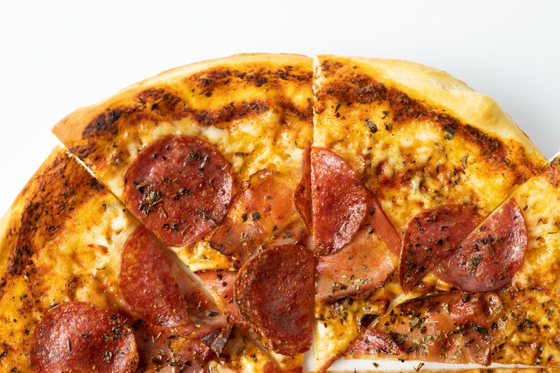 BBQ chicken pizza with caramelized onions and smoky sauce